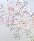 Colorful floral embroidery design on a light background tablecloth
