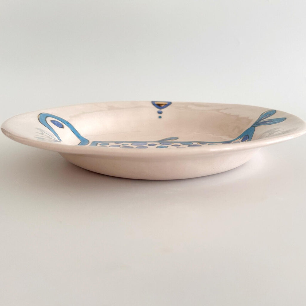 Ceramic bowl with blue floral patterns on a white background