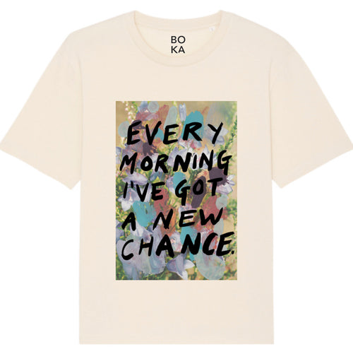A organic cotton t-shirt with a printed front featuring the text 'EVERY MORNING I'VE GOT A NEW CHANCE' surrounded by a multicolored abstract design. Every Morning affirmation tee — white organic cotton t-shirt with mental health print, unisex fit, charity tee by emerging artist