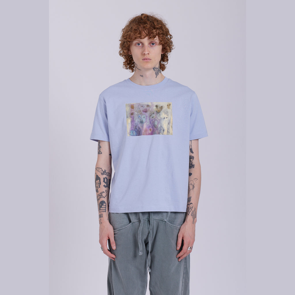 A serene blue organic cotton t-shirt with a hidden ghost abstract design on the front. Hidden Ghosts tee — serene blue organic cotton t-shirt with ghost print, unisex fit, mental health charity tee