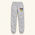 Organic cotton sweatpants in gray with a colorful smilie logo on the left leg. Happy Happy sweatpants — 320gsm organic cotton charity sweatpants, unisex fit, multi-cause made-to-order London