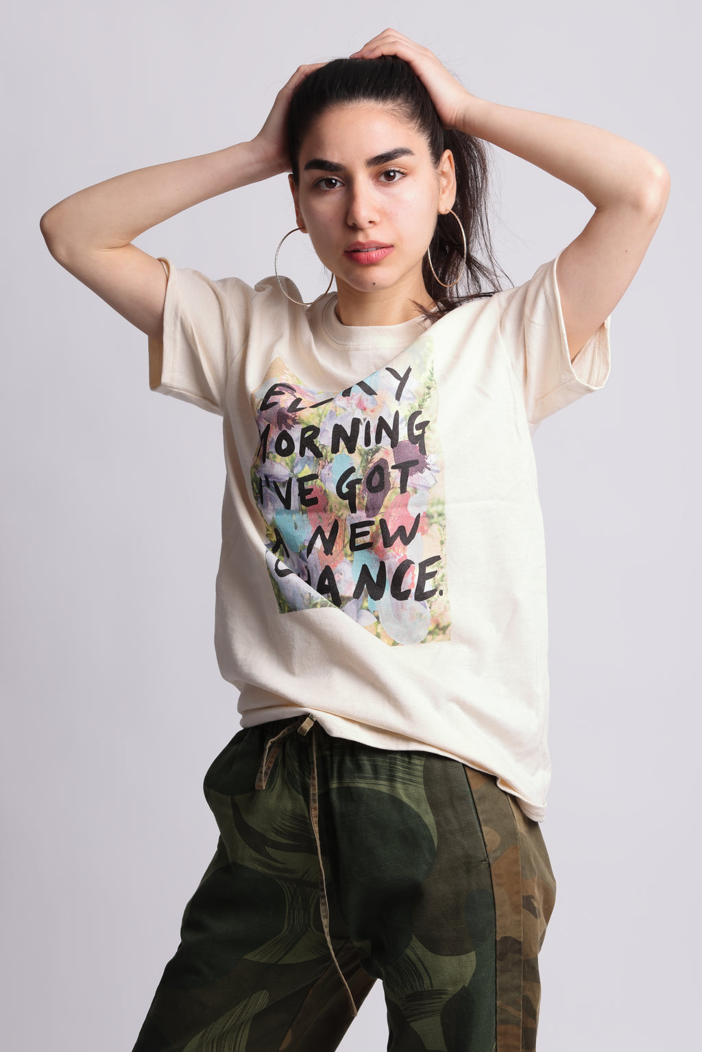 A organic cotton t-shirt with a printed front featuring the text 'EVERY MORNING I'VE GOT A NEW CHANCE' surrounded by a multicolored abstract design. Every Morning affirmation tee — white organic cotton t-shirt with mental health print, unisex fit, charity tee by emerging artist
