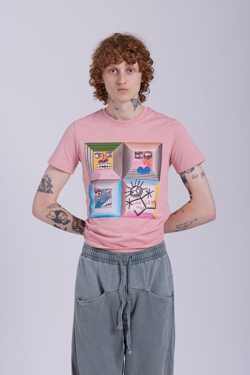 An organic cotton t-shirt in rose clay color with a graphic print of four different characters in a grid layout. Four Moods affirmation tee — rose clay organic cotton t-shirt with painted mood print, unisex fit, mental health charity
