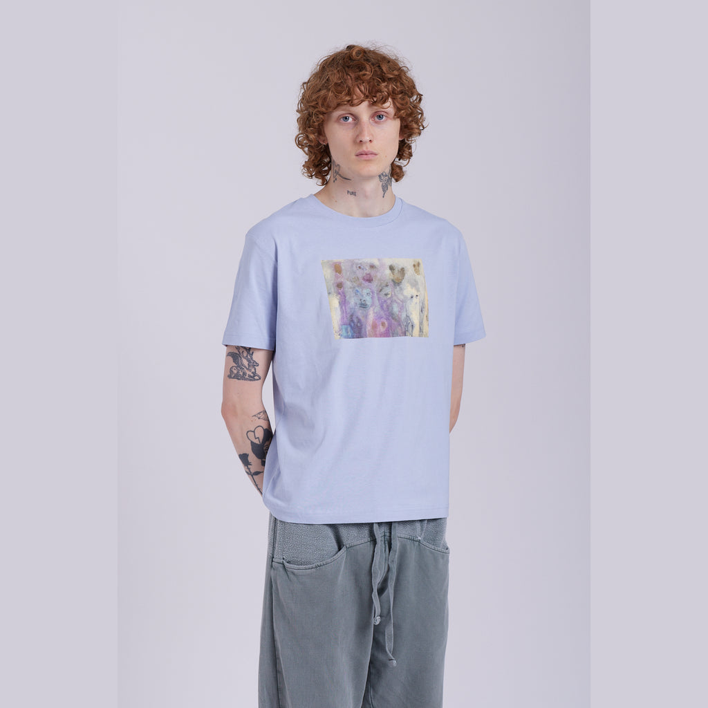 A serene blue organic cotton t-shirt with a hidden ghost abstract design on the front. Hidden Ghosts tee — serene blue organic cotton t-shirt with ghost print, unisex fit, mental health charity tee