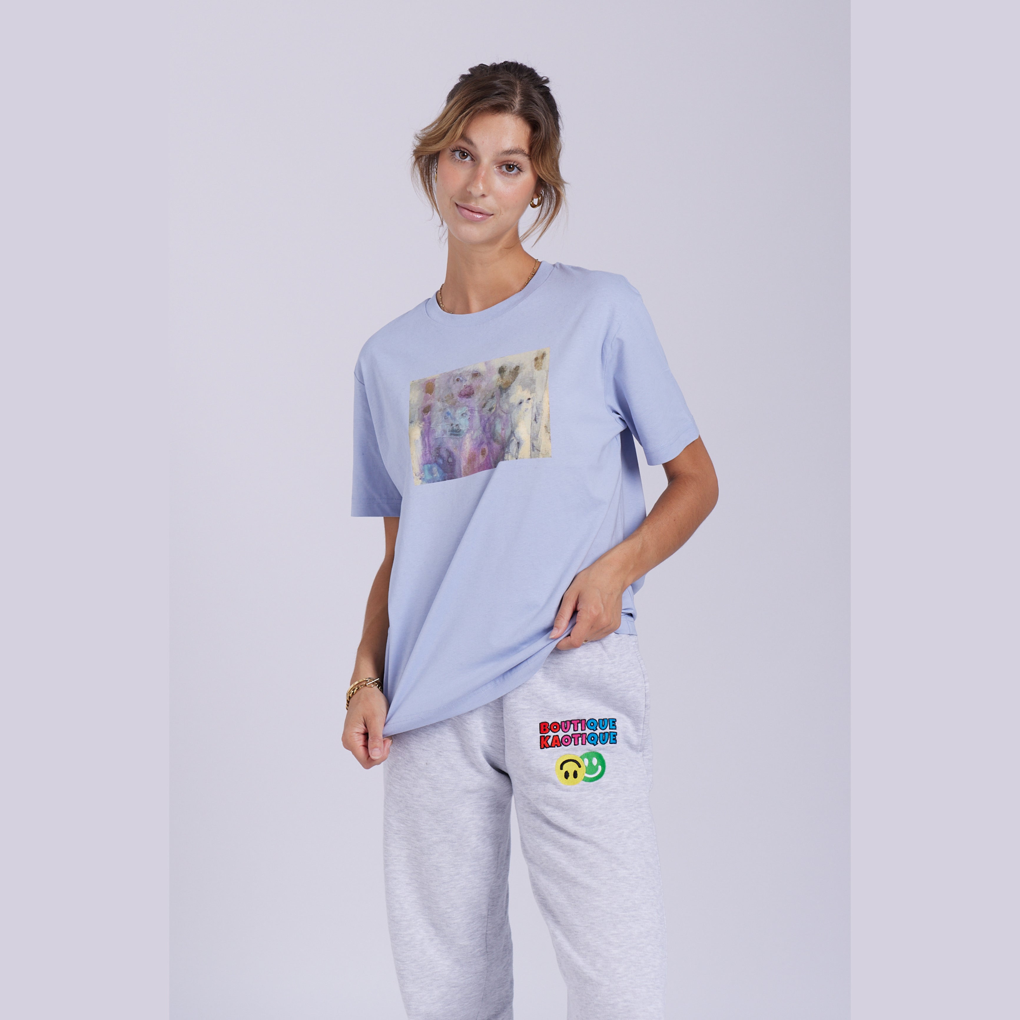 A serene blue organic cotton t-shirt with a hidden ghost abstract design on the front. Hidden Ghosts tee — serene blue organic cotton t-shirt with ghost print, unisex fit, mental health charity tee